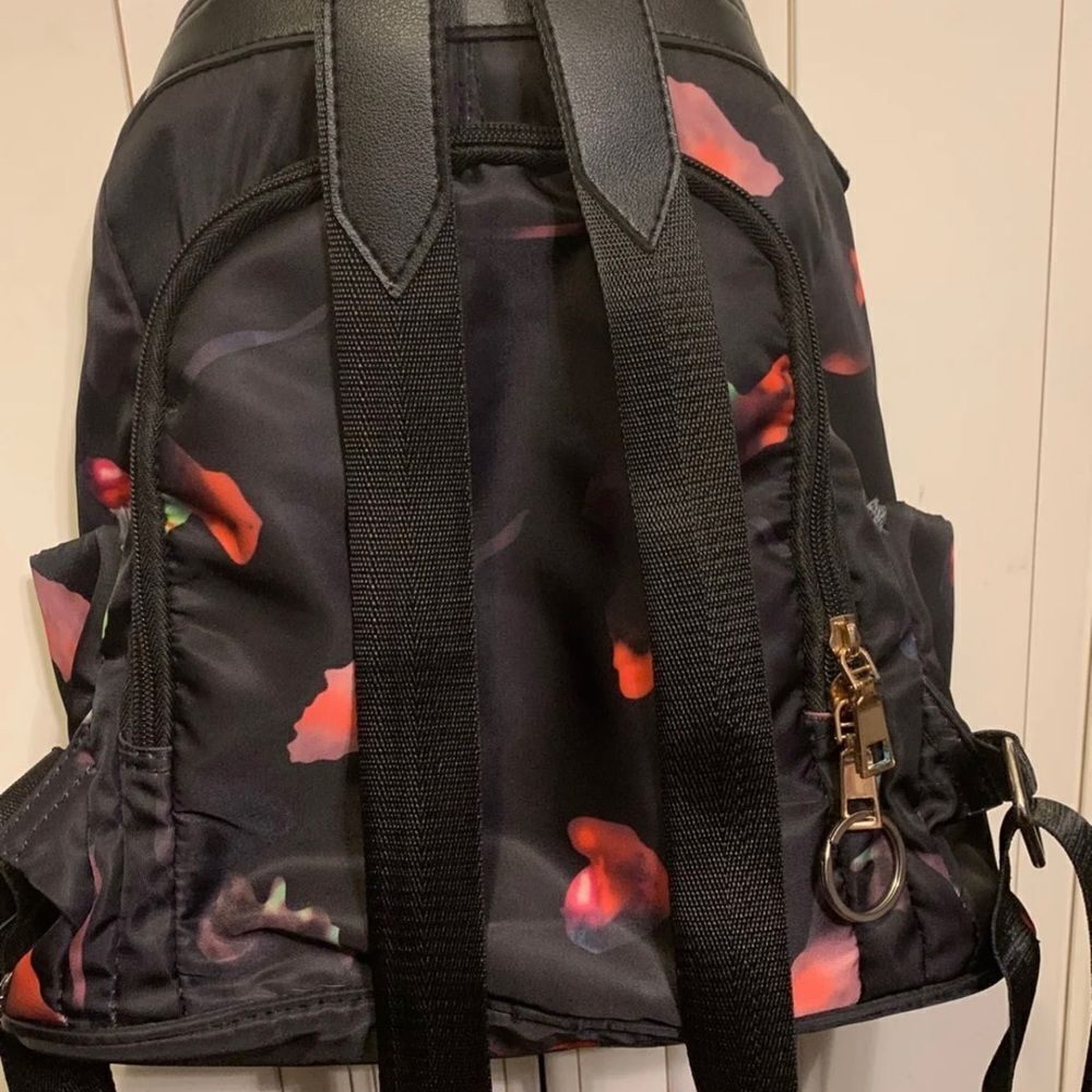 classic backpack and shoulder bag with antitheft design, abstract colors